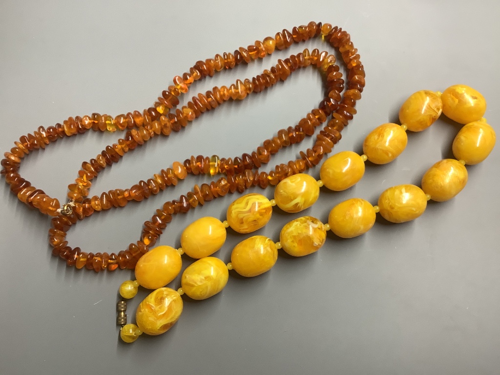 A single strand graduated cultured pearl necklace with rose cut diamond set 9 carat white gold class, 48 cm an amber necklace and three other necklaces.